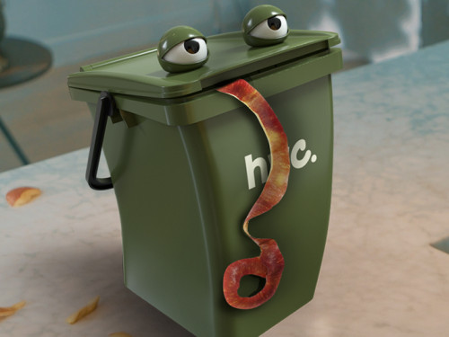 Animatie van een groen afvalbakje met oogjes en een appelschil uit zijn mond staat op het aanrecht